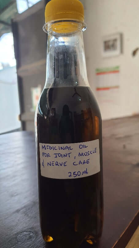 Bottle of medicinal Ayurvedic oil for joint, muscle, and nerve care, 250ml.